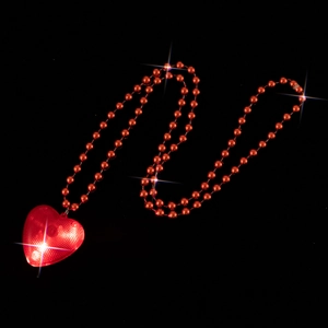 Stunning glowing red heart pendant LED necklace with red beads on black background