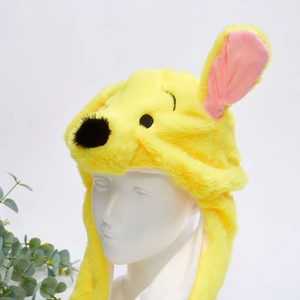 Close-up of yellow plush animal hat with moving ears and cute bear character design
