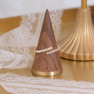 Detail of 14k gold plated cross ring featuring white pearls and sparkling cubic zirconia