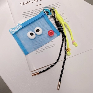Mini pochette porte-clés en maille bleue avec cordes tressées et motif œil de dessin animé