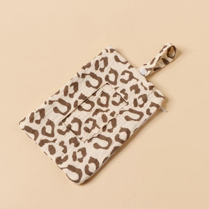 Detail view of cotton leopard print crib bag with clear window and snap hanging strap
