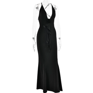 Detail of black mermaid evening dress with ruffled deep V-neck and 3D flower accent
