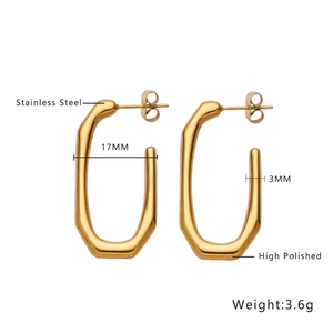 Detail of 17mm gold irregular stainless steel hoop earrings with high polished finish