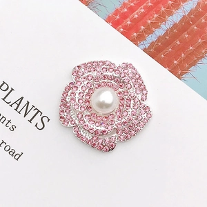 Sparkling zinc alloy pink crystal flower brooch with a central white pearl detail
