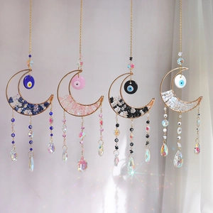 Moon shaped crystal suncatcher set with evil eye and rainbow prism drop pendants