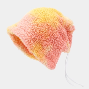 Macro detail of tie-dye faux shearling bucket hat with white drawstring adjustment cord