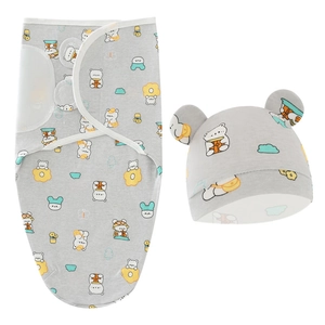 Detail shot of a grey newborn swaddle cocoon and matching hat with cartoon bear prints