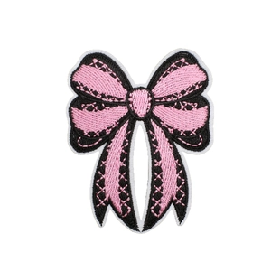 Pink and black bow embroidered patch with detailed cross-stitch and finished edges