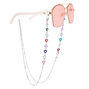 Close-up of heart enamel charms and crystal beads on a silver eyewear chain