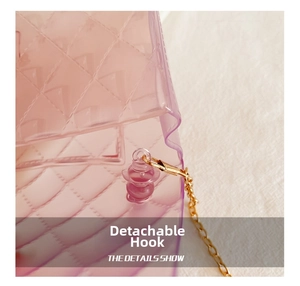 Detail of pink transparent jelly bag featuring diamond quilted texture and golden metal hook