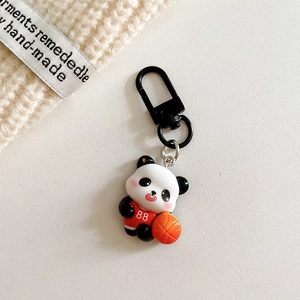 Close-up of cute sports panda keychain wearing red basketball jersey with number 88