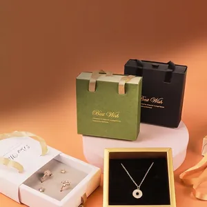 Luxury jewelry gift box with drawer handle design in green, black, white, and gold colors