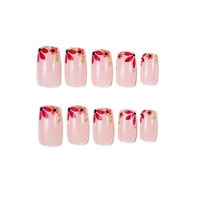 Short square press-on nails with cute red floral designs and gold foil accents