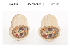 Detailed wood carved acorn ornament with fall leaves and forest squirrel motifs