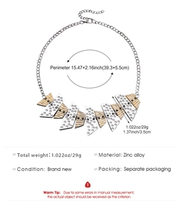 Detailed view of geometric V-shaped zinc alloy necklace with brushed metal finish