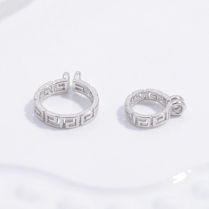 Detailed view of S925 silver Greek key pattern jewelry connectors with ring attachments