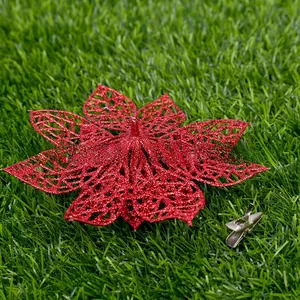 Detail of red hollow glitter flower with a silver metal clip for Christmas tree decoration