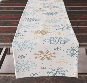 Detail of Christmas table runner with blue and gold snowflakes on rustic wood