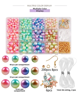 DIY jewelry kit detail featuring 15-grid gradient pearls with beads, hooks and shell charms