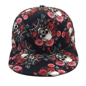 Flat brim hip hop hat featuring gothic skull and red rose graffiti on black canvas