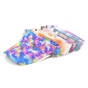 Outdoor tie-dye sun visor hats for women displayed in multiple bright beach colors