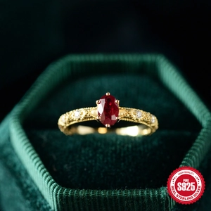 Elegant vintage S925 sterling silver ring with oval ruby and golden relief in velvet box