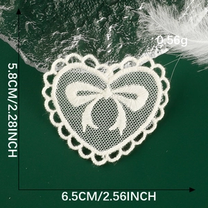 Detailed size specifications of white lace heart patch with embroidered bow details