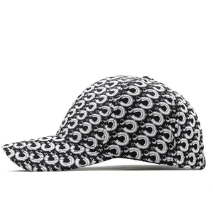 Detail of black and white horseshoe jacquard pattern on a structured baseball cap