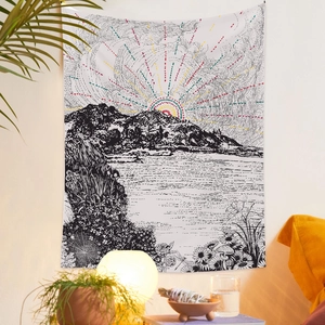 Detail of artistic black and white tapestry with landscape design and color sun accents