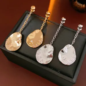 Asymmetric 18k gold plated tassel earrings with drop pendants and zircon accents