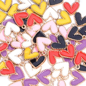 Detailed view of colorful heart enamel alloy pendants for DIY jewelry accessories