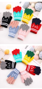 Detailed knit texture of colorful cartoon cat gloves for children with white striped cuffs