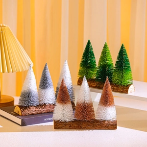 Miniature Christmas trees with glitter gradients and wooden bases for holiday desk decor