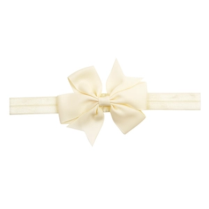 Elastic baby headband with ivory ribbed ribbon bow on a clean white background