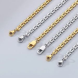 Detailed view of U-shaped link chains in gold and silver finish with lobster clasps