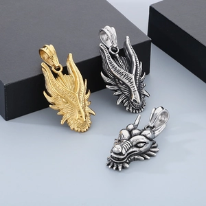 Dragon head pendants in gold, silver, and vintage silver finishes in a group display