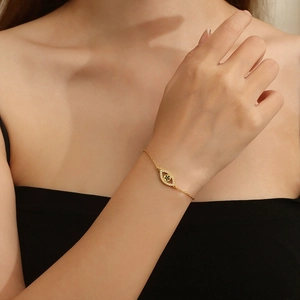 Gold-plated stainless steel hollow evil eye bracelet with sparkling crystals for women