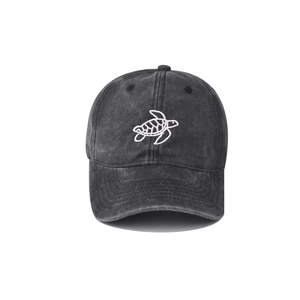 Detailed view of the vintage washed dark grey baseball cap with turtle embroidery