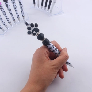 DIY beaded pen with cartoon paw prints, silicone topper and sparkling crystal accents