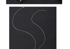 Detailed close-up of a silver stainless steel chain with polished metallic texture