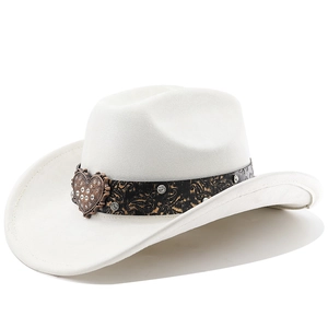 Detail of white wool cowboy hat featuring a black paisley band and heart crystal buckle