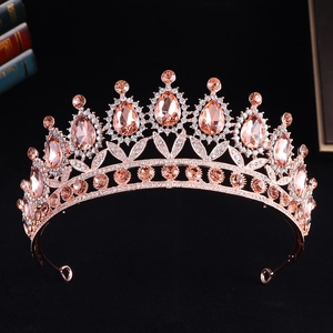 Detailed macro of a baroque bridal crown with pink teardrop gems and rose gold metal