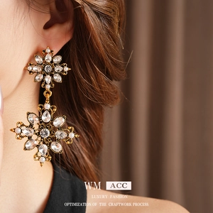 Vintage gold crystal and pearl drop earrings shown on model with elegant palace style