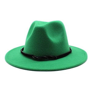 Macro detail of grass green wool felt wide brim hat with black braided band texture
