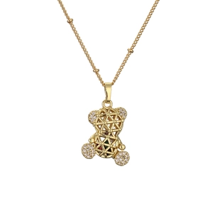 Golden necklace featuring a hollow geometric bear pendant with colorful beads and zircon