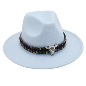 Close-up of light blue wool fedora with ethnic woven band and silver bull head detail