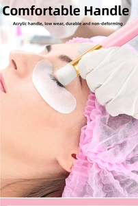 Detail of eyelash cleansing brush with pink acrylic handle for professional salon use