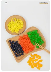Detailed macro view of miniature resin berries and fruit slices for DIY crafts and decor