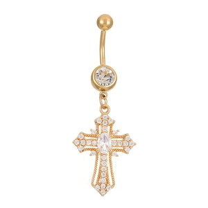 Macro detail of golden cross navel ring with inlaid crystals and oval center stone