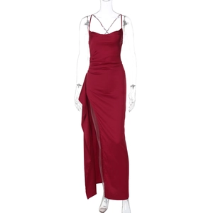 Detailed view of burgundy satin evening dress featuring high slit and lace-up back design